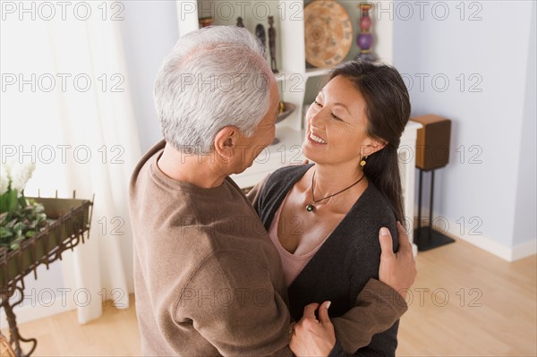 Older couple in embrace. Photo : Rob Lewine