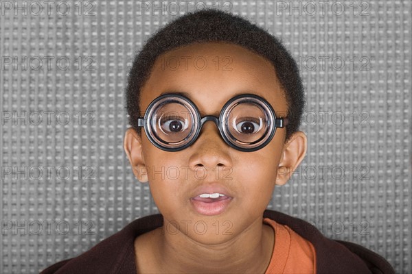 Young man with funny glasses. Photo : Rob Lewine