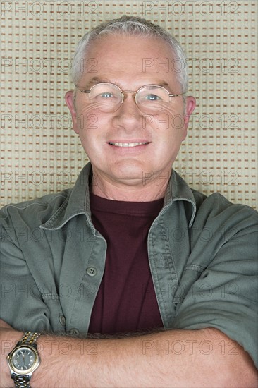 Portrait of older man in spectacles. Photo : Rob Lewine