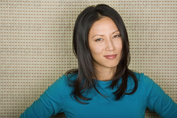 Studio portrait of mid adult woman. Photo : Rob Lewine