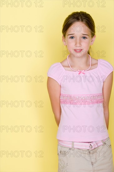 Studio shot portrait of teenage girl, three quarter length. Photo : Rob Lewine