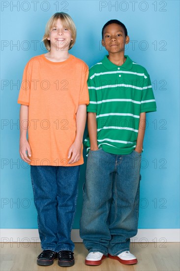 Studio shot portrait of two teenagers, full length. Photo : Rob Lewine