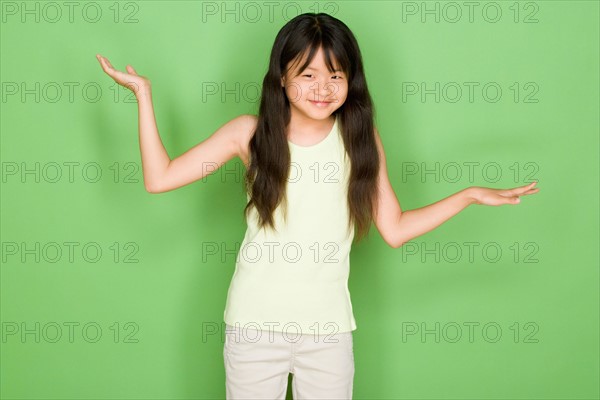 Studio shot portrait of teenage girl, three quarter length. Photo : Rob Lewine