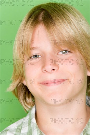 Studio shot portrait of teenage boy, close-up. Photo : Rob Lewine