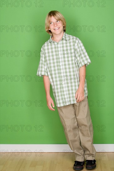 Studio shot portrait of teenage boy, full length. Photo : Rob Lewine