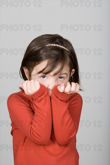 Studio shot portrait of girl, waist up. Photo : Rob Lewine