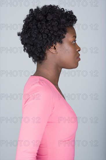 Studio shot portrait of mid adult woman, side view. Photo : Rob Lewine