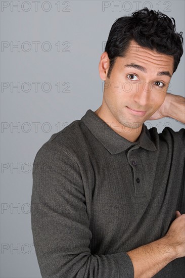 Studio shot portrait of mid adult man, head and shoulders. Photo : Rob Lewine