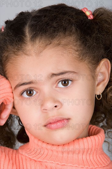 Studio shot portrait of girl, close-up. Photo : Rob Lewine