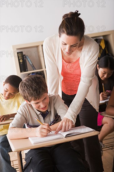 Teacher attending to schoolboy. Photo : Rob Lewine