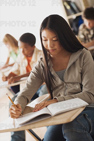 Class writing in their copy books. Photo : Rob Lewine