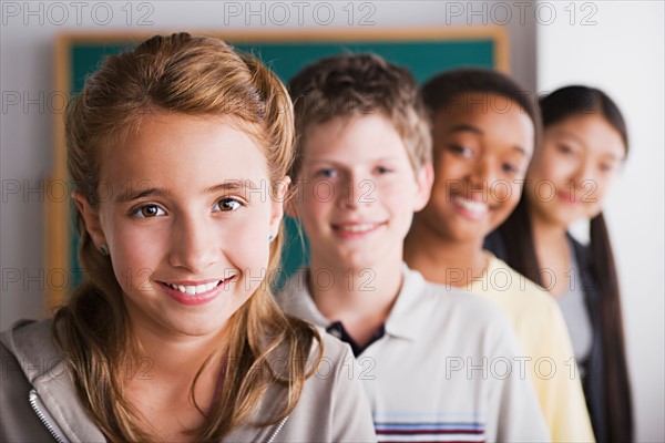 Group of schoolchildren posing together. Photo : Rob Lewine