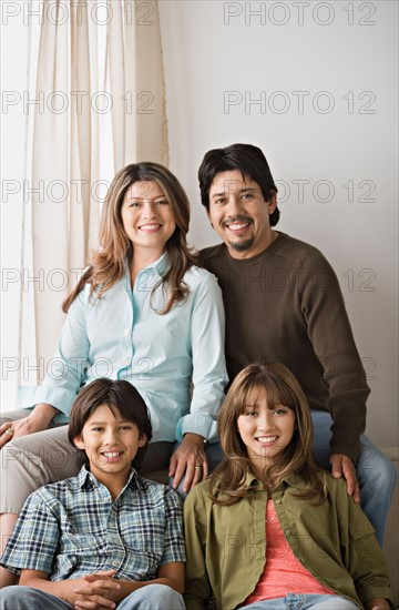 Portrait of smiling family. Photo : Rob Lewine