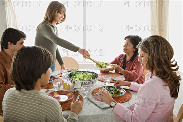 Family having meal together. Photo : Rob Lewine