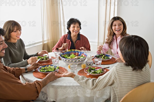 Family having meal together. Photo : Rob Lewine