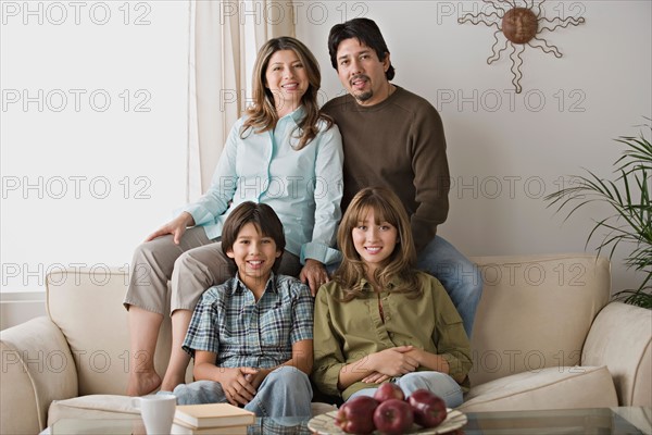 Portrait of smiling family. Photo : Rob Lewine