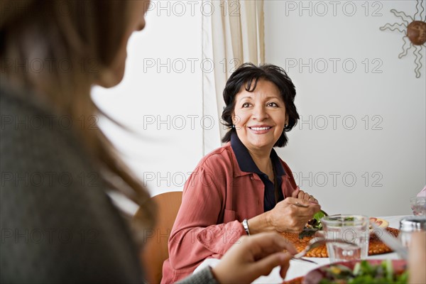 Family having meal together. Photo : Rob Lewine