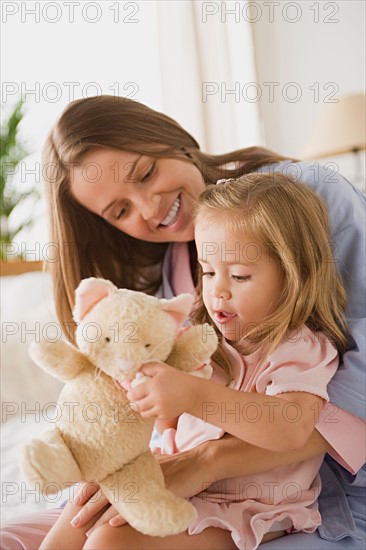 Mother playing with daughter. Photo : Rob Lewine