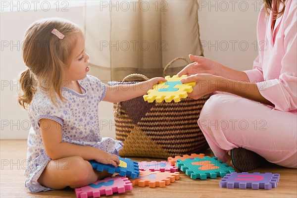 Mother playing with daughter. Photo : Rob Lewine