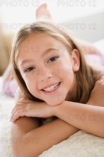 Portrait of girl with arms crossed. Photo : Rob Lewine