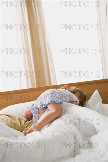 Daughter waking up father. Photo : Rob Lewine