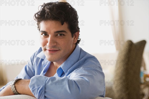 Portrait of smiling man at home. Photo : Rob Lewine