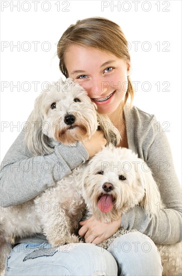 Portrait of teenage girl with puppies of cotton de tulear. Photo : Elena Elisseeva