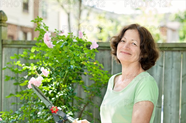 Woman working in garden. Photo : Elena Elisseeva