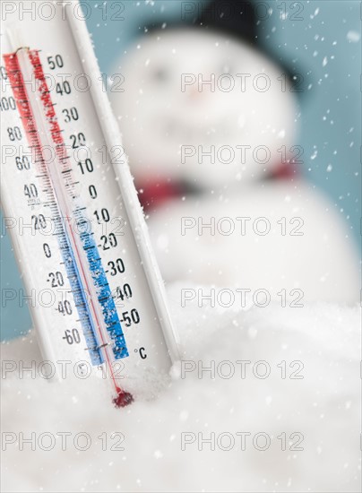 Studio shot of thermometer with snowman.