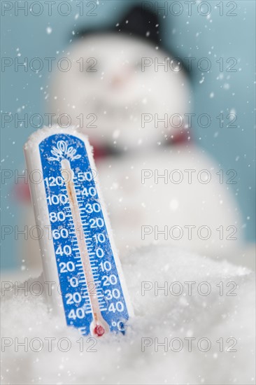 Studio shot of thermometer with snowman.