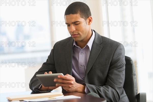 Businessman using tablet pc.