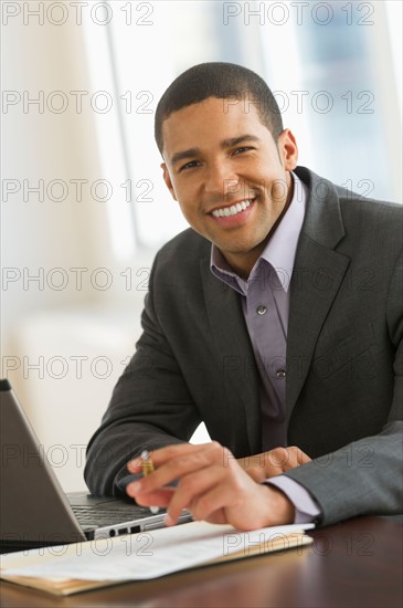 Portrait of businessman smiling.