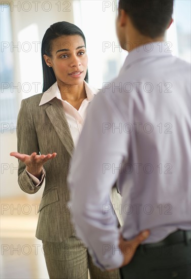 Business man and woman arguing.