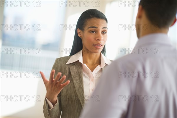 Business man and woman arguing.