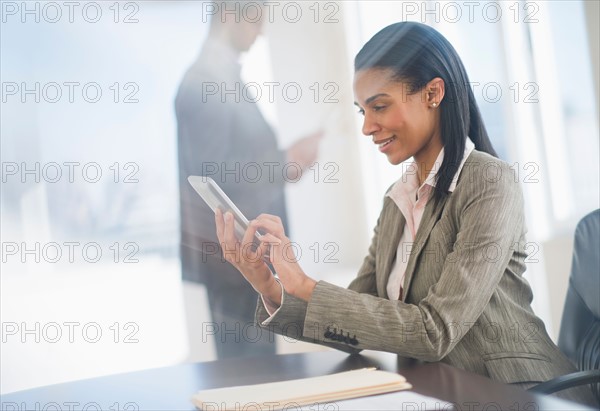 Business woman using tablet pc.