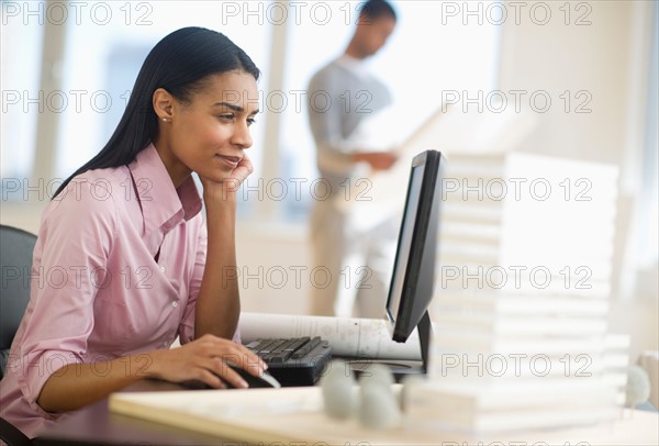 Female architect in office.