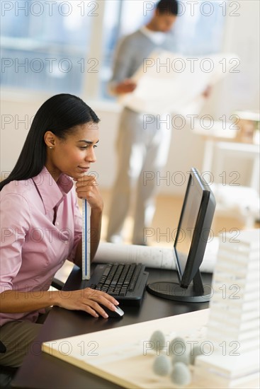 Female architect in office.