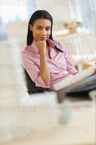 Portrait of female architect in office.