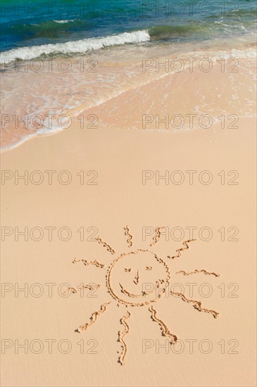 Mexico, Yucatan. Sun drawing on beach.