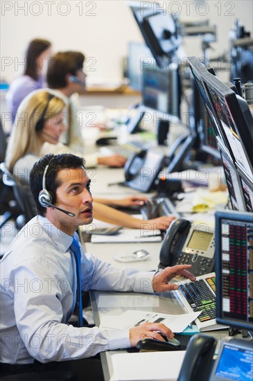 Traders at trading desk.