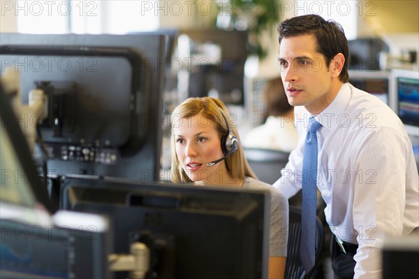 Traders at trading desk.