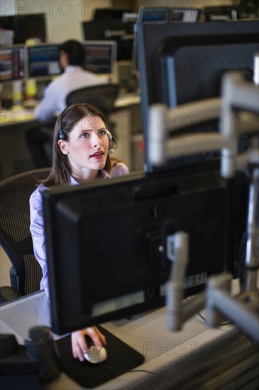 Traders at trading desk.