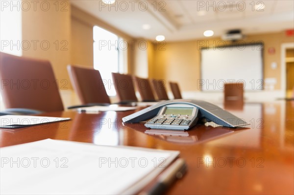 Conference phone on conference table.