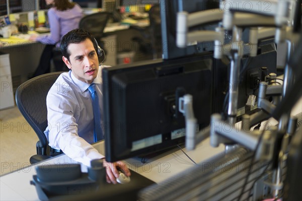 Traders at trading desk.