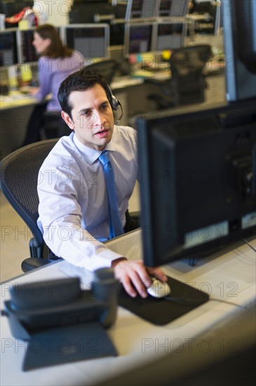 Traders at trading desk.