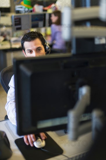 Traders at trading desk.