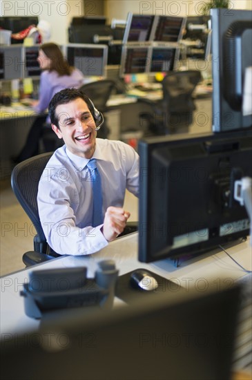 Traders at trading desk.