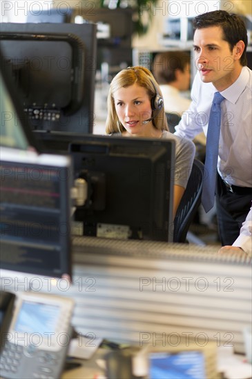 Traders at trading desk.