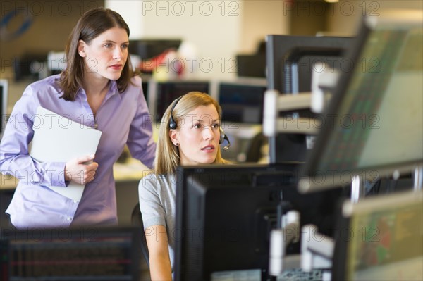 Traders at trading desk.