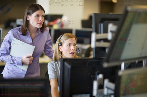 Traders at trading desk.